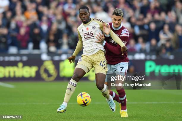 Gianluca Scamacca of West Ham United being followed by Boubakary Soumare of Leicester City during the Premier League match between West Ham United...