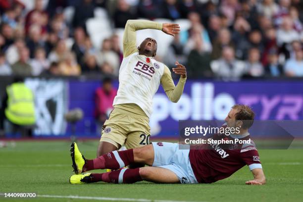 Patson Daka of Leicester City being fouled Craig Dawson of West Ham United during the Premier League match between West Ham United and Leicester City...