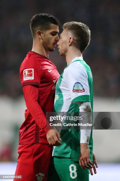 Andre Silva of RB Leipzig argue with Mitchell Weiser of SV Werder Bremen during the Bundesliga match between SV Werder Bremen and RB Leipzig at...