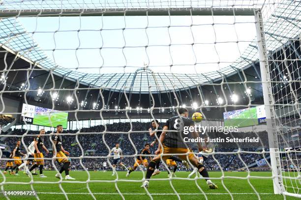Harry Kane of Tottenham Hotspur scores their team's first goal during the Premier League match between Tottenham Hotspur and Leeds United at...