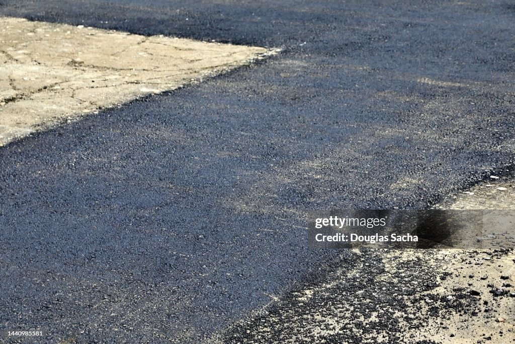 Road being resurfaced with hot mix asphalt