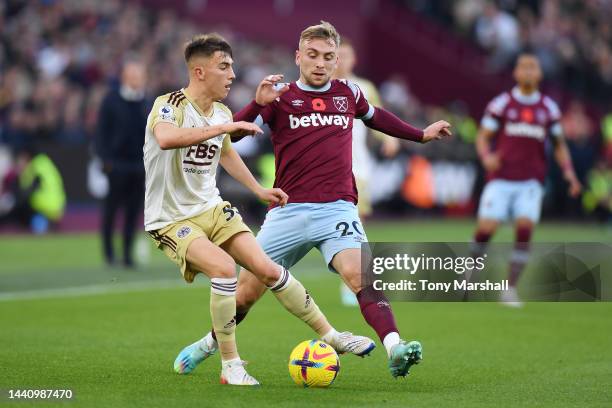 Luke Thomas of Leicester City being followed by Jarrod Bowen of West Ham United during the Premier League match between West Ham United and Leicester...