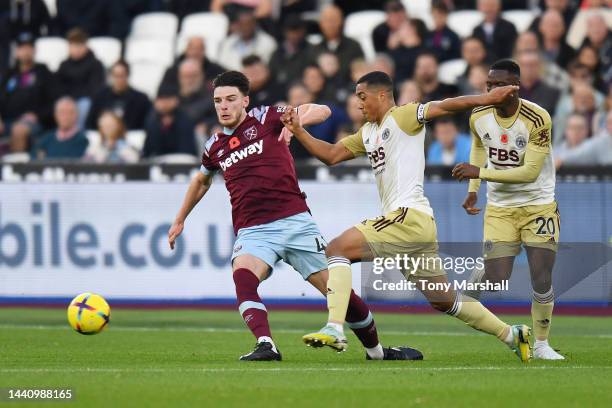 Youri Tielemans of Leicester City competes for the ball with Declan Rice of West Ham United during the Premier League match between West Ham United...