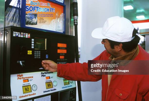 Man Using Automated Pump At Gas Station, Accepts Credit /Debit Cards; Video System.