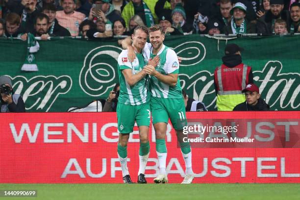 Christian Gross of SV Werder Bremen celebrates after scoring their fist side goal with Niclas Fullkrug of SV Werder Bremen during the Bundesliga...