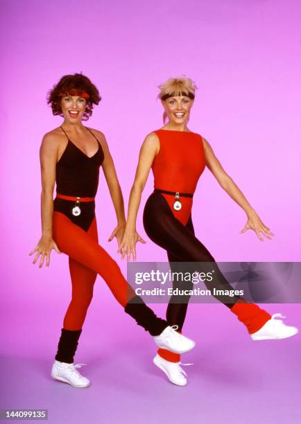 Two Women In Workout Clothes Doing Aerobics.
