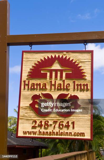 Hana Hale Inn Sign With Bungalows By Water In Remote Hana In Maui, Hawaii.