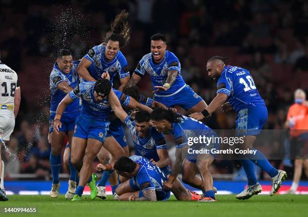 Samoa celebrate after Stephen Crichton kicks the winning golden point drop goal to win the Rugby League World Cup Semi-Final match between...