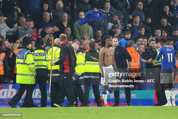 Alex Iwobi of Everton who handed his shirt to an Everton fan has it thrown back at him by angry fans after their side's 3-0 defeat during the Premier...