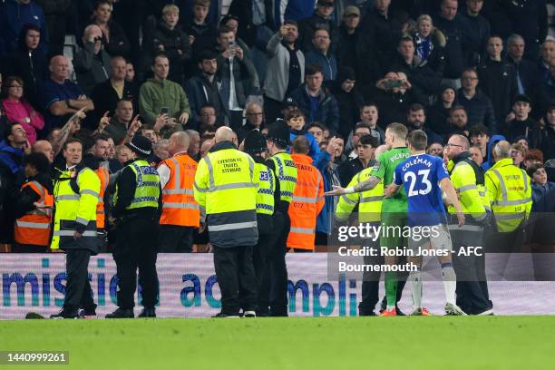 Jordan Pickford and Seamus Coleman of Everton tries to placate angry Everton fans after his side's 3-0 defeat during the Premier League match between...