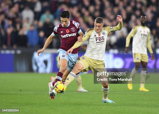 Nayef Aguerd of West Ham United is challenged by Jamie Vardy of Leicester City during the Premier League match between West Ham United and Leicester...