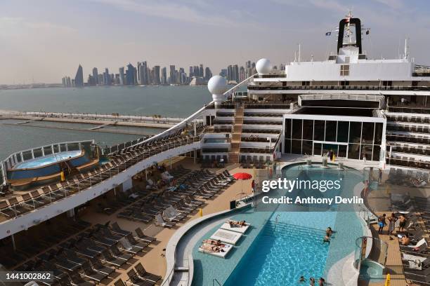 Guests relax beside the pool on board MSC World Europa ahead of tomorrow's naming ceremony on November 12, 2022 in Doha, Qatar.