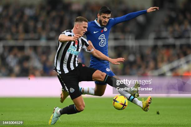 Sven Botman of Newcastle United is challenged by Armando Broja of Chelsea during the Premier League match between Newcastle United and Chelsea FC at...