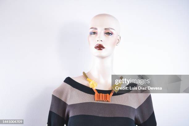 mannequin trying necklace made with macaroons. - carbohydrate food type stock pictures, royalty-free photos & images