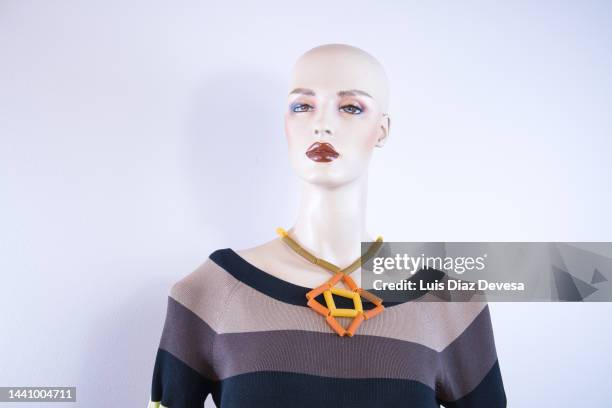 mannequin trying necklace made with macaroons. - carbohydrate food type stock pictures, royalty-free photos & images