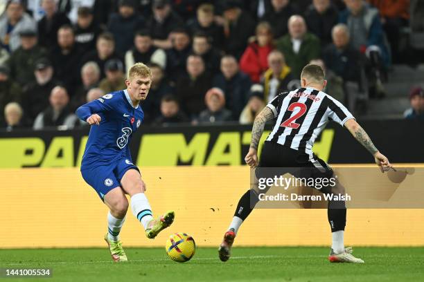 Lewis Hall of Chelsea is challenged by Kieran Trippier of Newcastle United during the Premier League match between Newcastle United and Chelsea FC at...