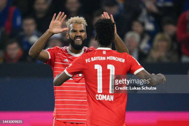 Eric Maxim Choupo-Moting of Bayern Munich celebrates with teammate Kingsley Coman after scoring their team's second goal during the Bundesliga match...