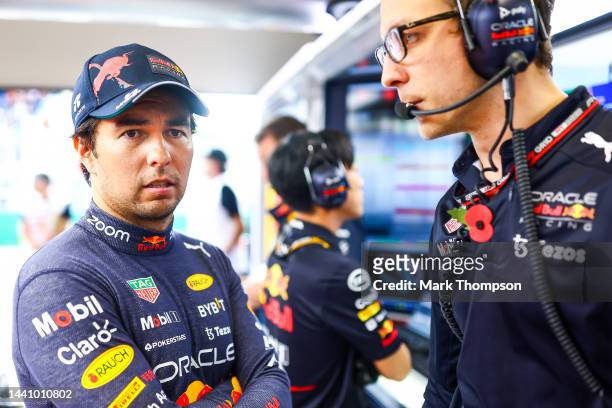 Sergio Perez of Mexico and Oracle Red Bull Racing talks with race engineer Hugh Bird in the garage prior to the Sprint ahead of the F1 Grand Prix of...