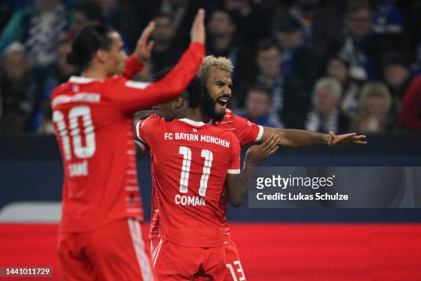 Eric Maxim Choupo-Moting of Bayern Munich celebrates with teammate Kingsley Coman after scoring their team's second goal during the Bundesliga match...