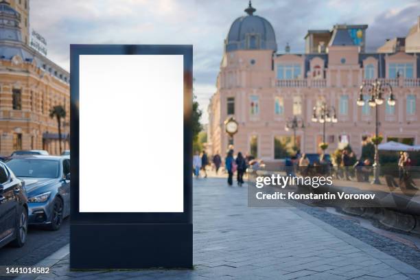 blank city format (lightposter, citylight) banner pylon on the sidewalk mockup. - electronic billboard stock pictures, royalty-free photos & images