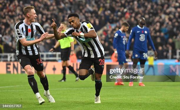 Newcastle player Joe Willock celebrates with Sean Longstaff after scoring the winning goal during the Premier League match between Newcastle United...