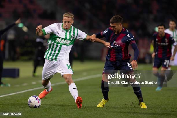 Davide Frattesi of US Sassuolo competes for the ball with Nicolas Dominguez of Bologna FC during the Serie A match between Bologna FC and US Sassuolo...