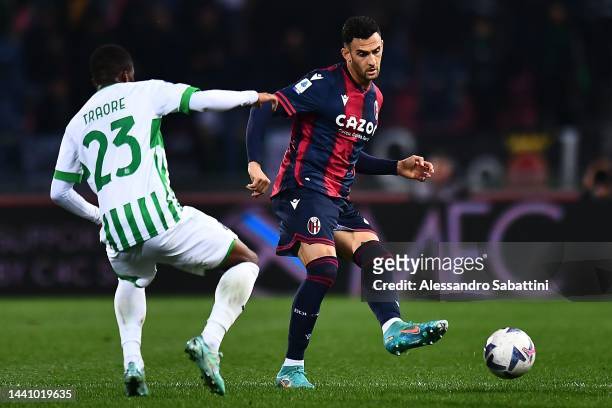 Charalampos Lykogiannis of Bologna FC competes for the ball with Hamed Traorè of US Sassuolo during the Serie A match between Bologna FC and US...