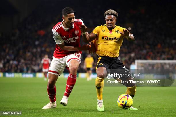 Adama Traore of Wolverhampton Wanderers is challenged by William Saliba of Arsenal during the Premier League match between Wolverhampton Wanderers...