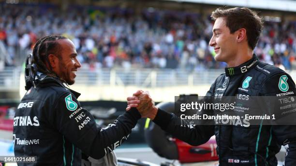 Sprint winner George Russell of Great Britain and Mercedes and Third placed Lewis Hamilton of Great Britain and Mercedes celebrate in parc ferme...