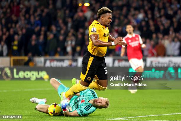 Adama Traore of Wolverhampton Wanderers battles for possession with Aaron Ramsdale of Arsenal during the Premier League match between Wolverhampton...