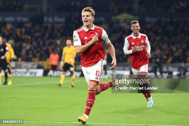 Martin Oedegaard of Arsenal celebrates after scoring their team's first goal during the Premier League match between Wolverhampton Wanderers and...