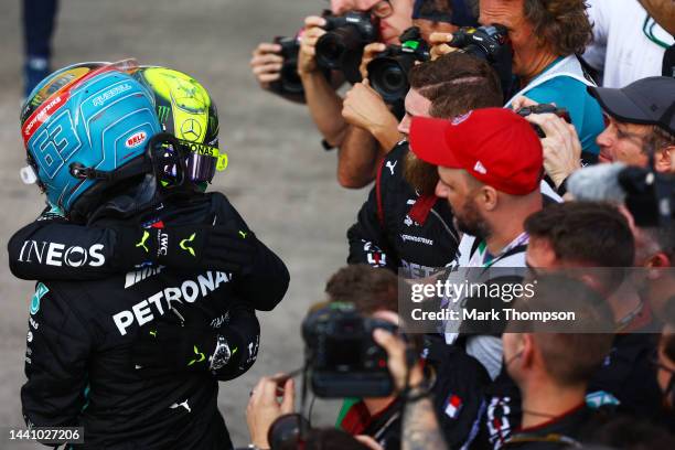 Sprint winner George Russell of Great Britain and Mercedes and Third placed Lewis Hamilton of Great Britain and Mercedes celebrate in parc ferme...