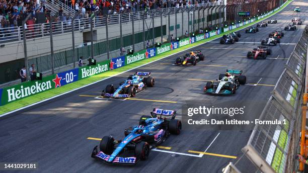 Esteban Ocon of France driving the Alpine F1 A522 Renault leads a line of cars from the grid during the Sprint ahead of the F1 Grand Prix of Brazil...