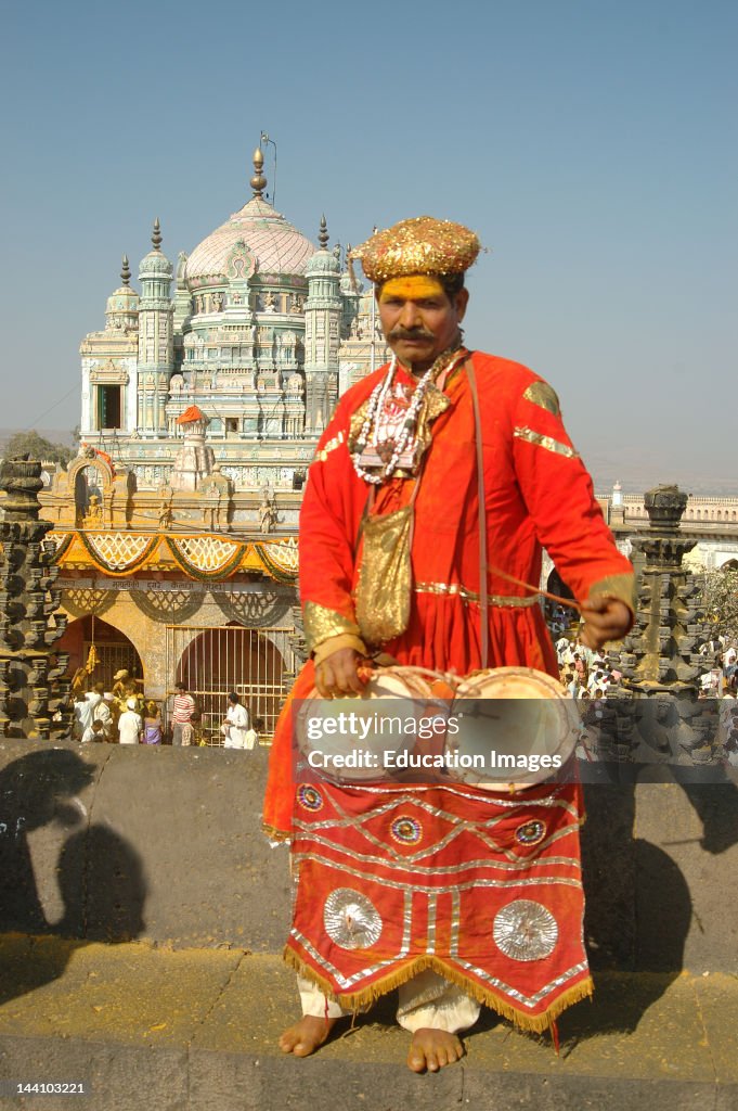 Indian Musical Instrument Player Sambal With Background Of Khandoba At Jejuri, Pune, Maharashtra, India.