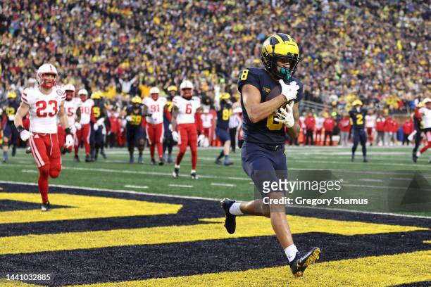 Ronnie Bell of the Michigan Wolverines catches a first half touchdown pass while playing the Nebraska Cornhuskers at Michigan Stadium on November 12,...