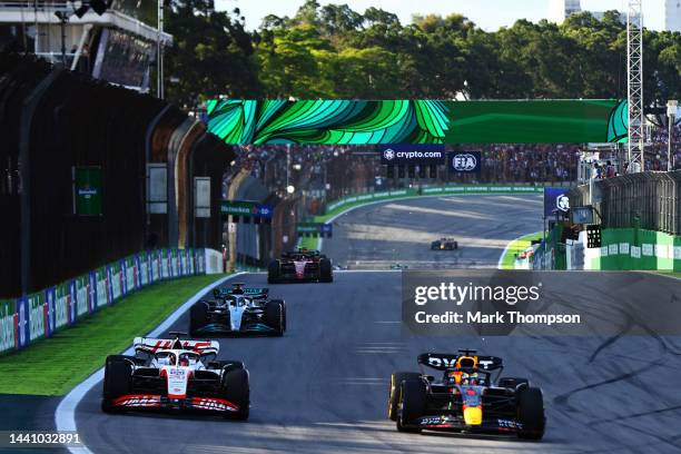 Max Verstappen of the Netherlands driving the Oracle Red Bull Racing RB18 and Kevin Magnussen of Denmark driving the Haas F1 VF-22 Ferrari battle for...