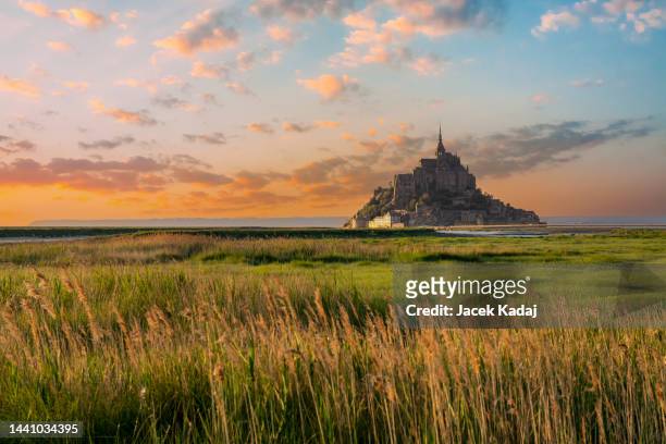mont saint-michel a former male benedictine monastery - normandy stock pictures, royalty-free photos & images