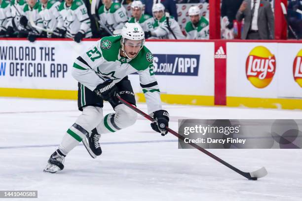 Mason Marchment of the Dallas Stars plays the puck down the ice during first period action against the Winnipeg Jets at the Canada Life Centre on...