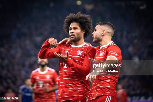 Serge Gnabry and Lucas Hernandez of FC Bayern Muenchen celebrate a goal during the Bundesliga match between FC Schalke 04 and FC Bayern München at...