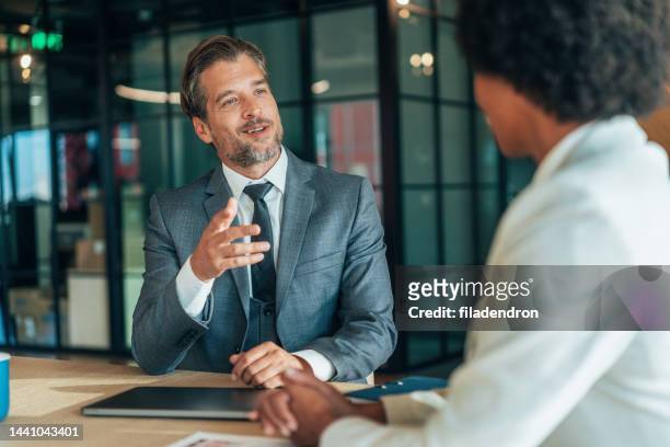 business coworkers - businessman talking stock pictures, royalty-free photos & images
