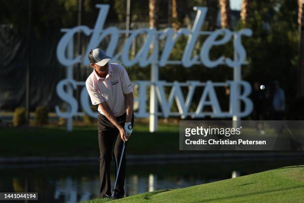 Steven Alker of New Zealand chips onto the 18th green during the third round of the Charles Schwab Cup Championship at Phoenix Country Club on...