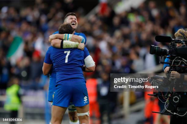 Sebastian Negri of Italy hugs Michele Lamaro at the end of the Autumn International match between Italy and Australia at Stadio Artemio Franchi on...