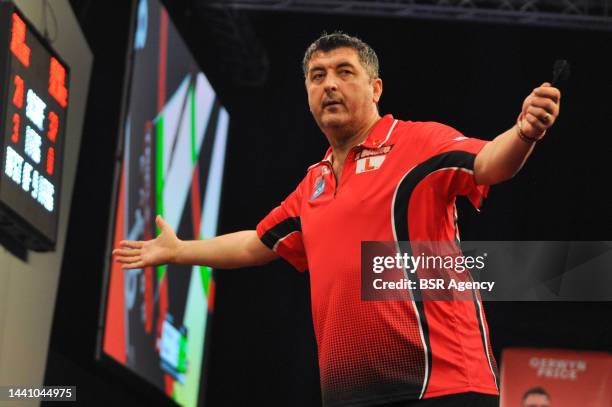 Mensur Suljovic of Austria during the Cazoo Grand Slam of Darts group match at Aldersley Leisure Village on November 12, 2022 in Wolverhampton,...