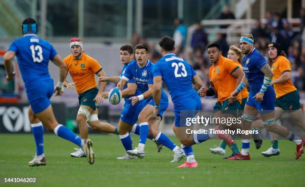 Tommaso Allan of Italy passes the ball out wide during the Autumn International match between Italy and Australia at Stadio Artemio Franchi on...