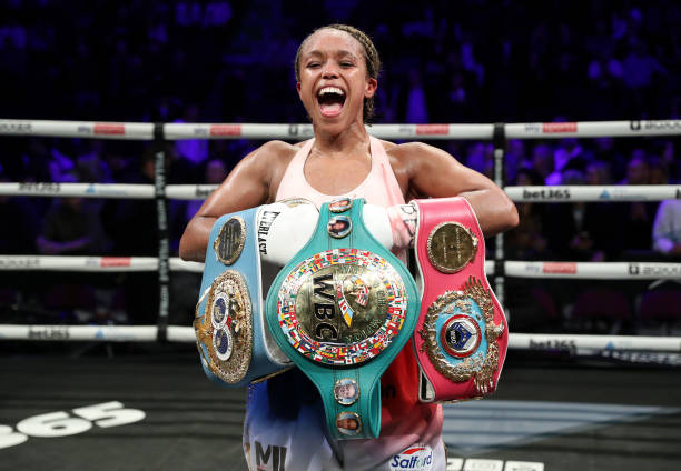 Natasha Jonas celebrates with the WBC, WBO, IBF World Super-weight belts after victory in the the WBC, WBO, IBF World Super-weight championship fight...