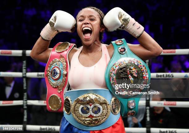 Natasha Jonas celebrates with the WBC, WBO, IBF World Super-weight belts after victory in the the WBC, WBO, IBF World Super-weight championship fight...