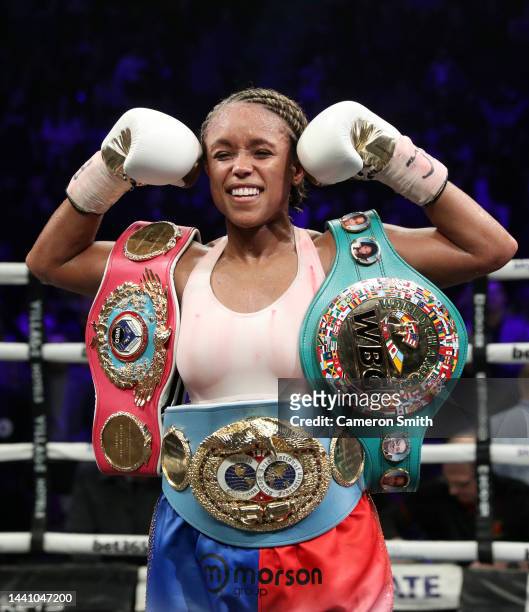 Natasha Jonas celebrates with the WBC, WBO, IBF World Super-weight belts after victory in the the WBC, WBO, IBF World Super-weight championship fight...