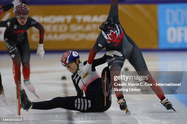 Suk Hee Shim of South Korea falls and collides with Courtney Sarault of Canada as they cross the finish line in the Women's 1000m A Final during the...