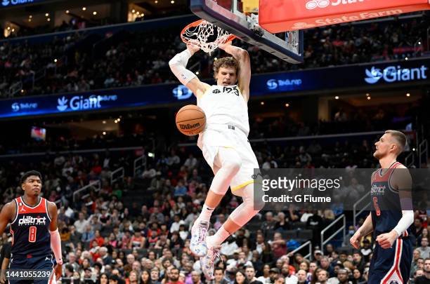 Lauri Markkanen of the Utah Jazz dunks the ball in the fourth quarter against the Washington Wizards at Capital One Arena on November 12, 2022 in...
