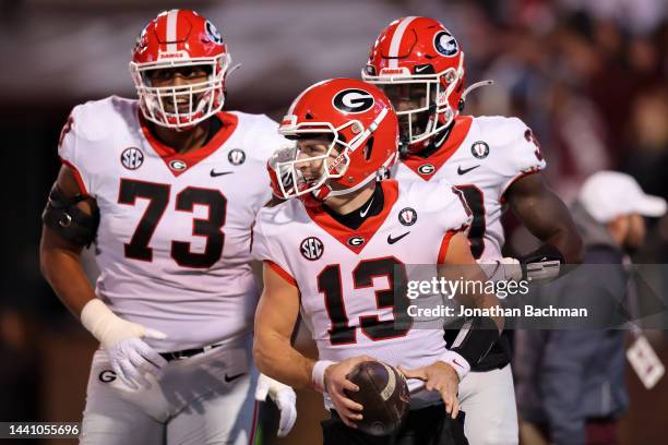 Stetson Bennett of the Georgia Bulldogs celebrates a touchdown during the first half of the game against the Mississippi State Bulldogs at Davis Wade...